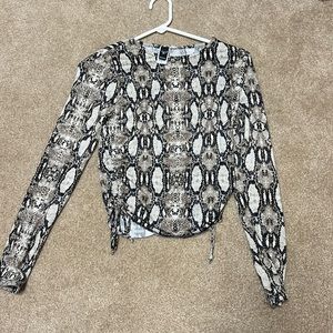 Long sleeve snake print top